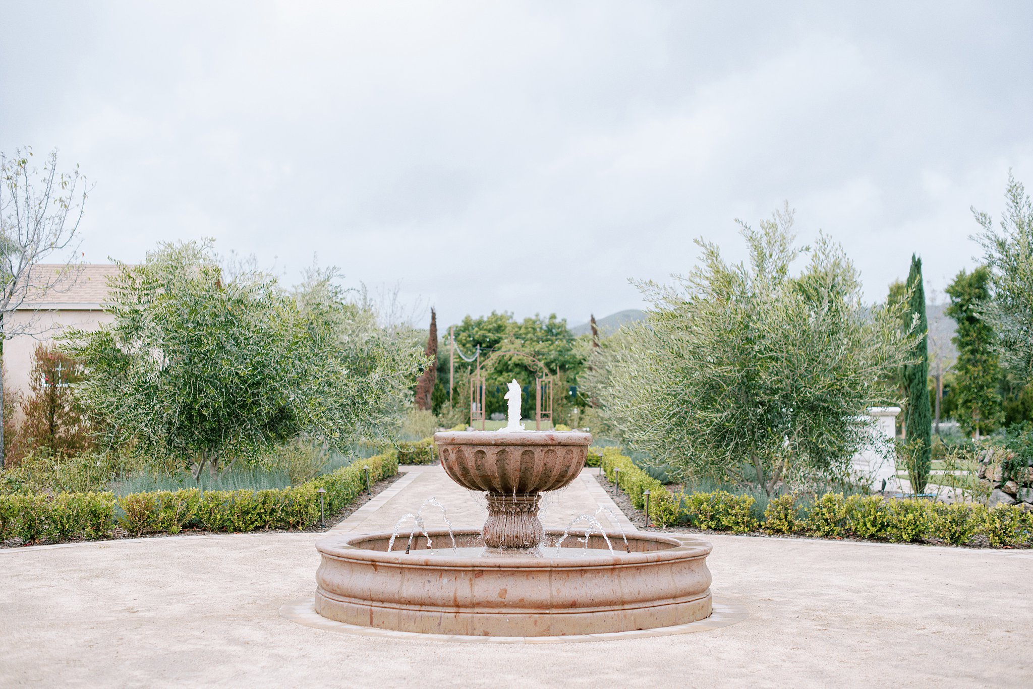 Antique water fountain located at the entrance of Tuscan Rose Ranch